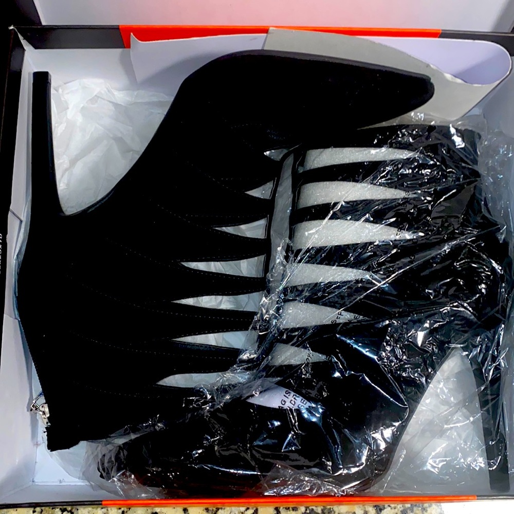 Black suede ankle booties. Size 9 1/2. Brand= G by Guess